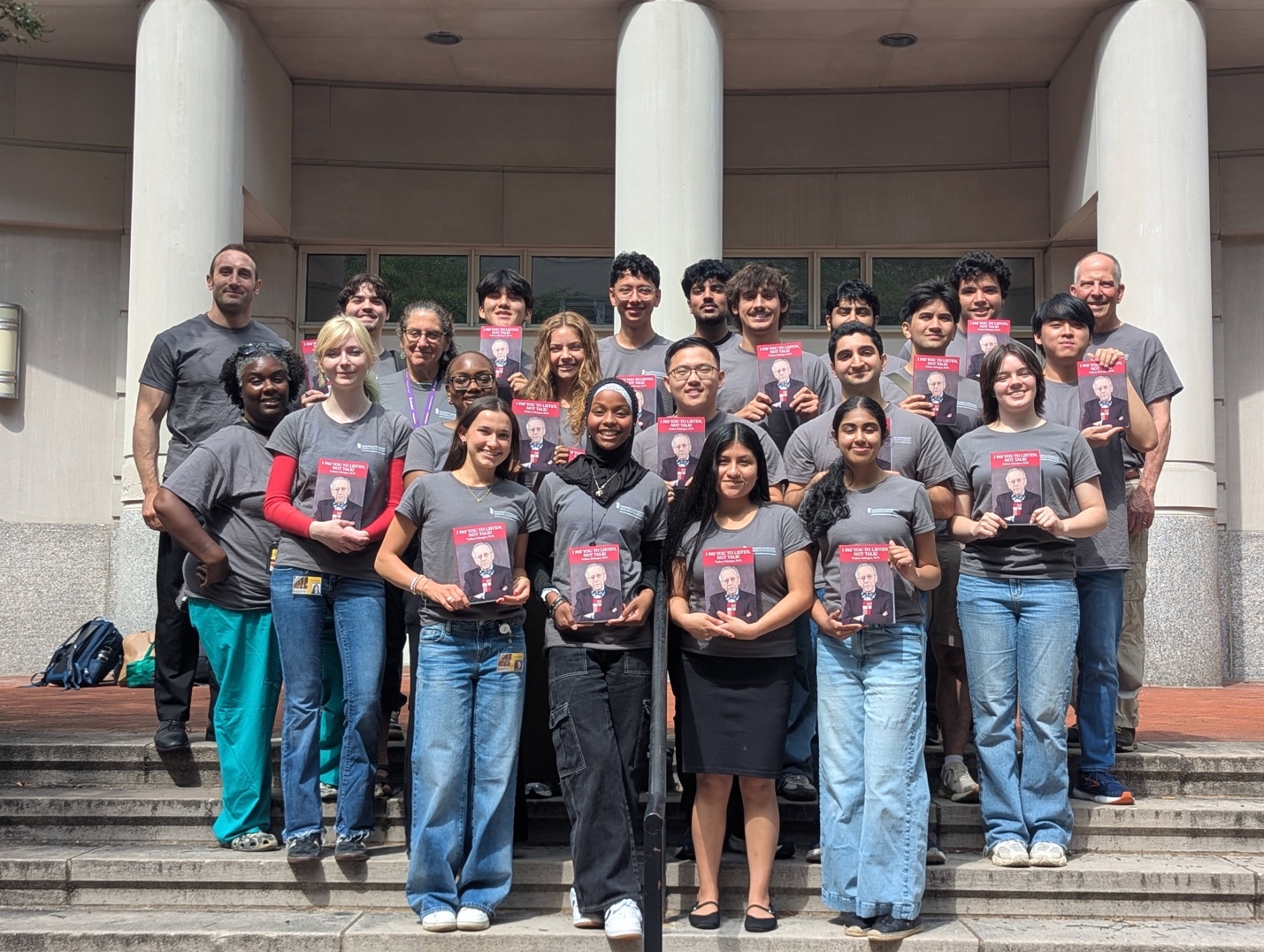 NSIP student interns holding copies of Dr. Schnaper's memoir